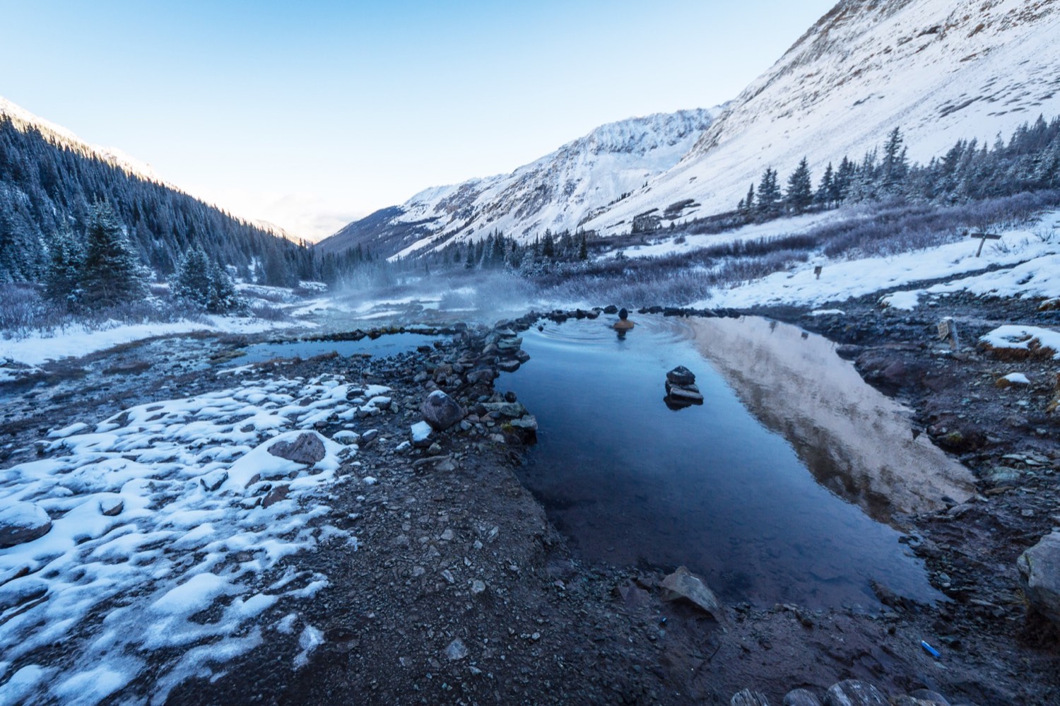 A steaming hot spring in the mountains